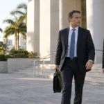 Attorney and adult client arriving at a South Florida courthouse for a probation violation matter